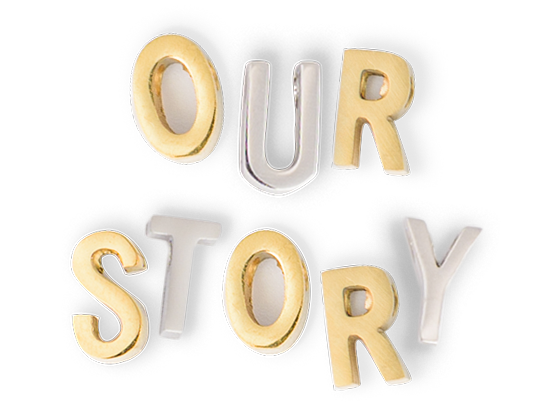 Letter charms spelling "Our Story"